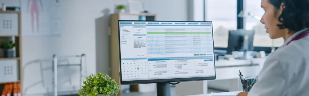 physician coding on desktop